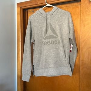 NWT women’s Reebok gray hoodie with kangaroo pockets and side slits, size M